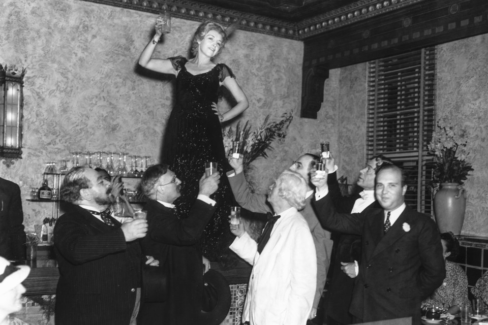 Toast during New Year's eve party --- Image by © Bettmann/CORBIS